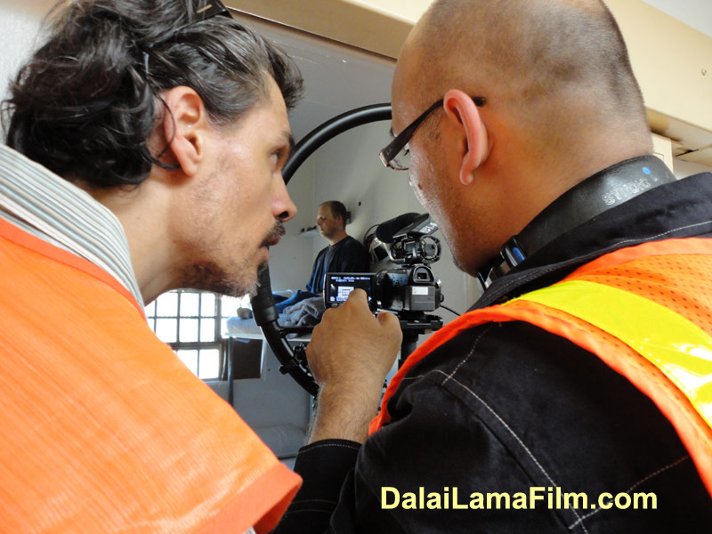 Dalai Lama Renaissance Crew Member Leo D speaks with Director Khashyar Darvich during filming of a Dalai Lama Prison Film