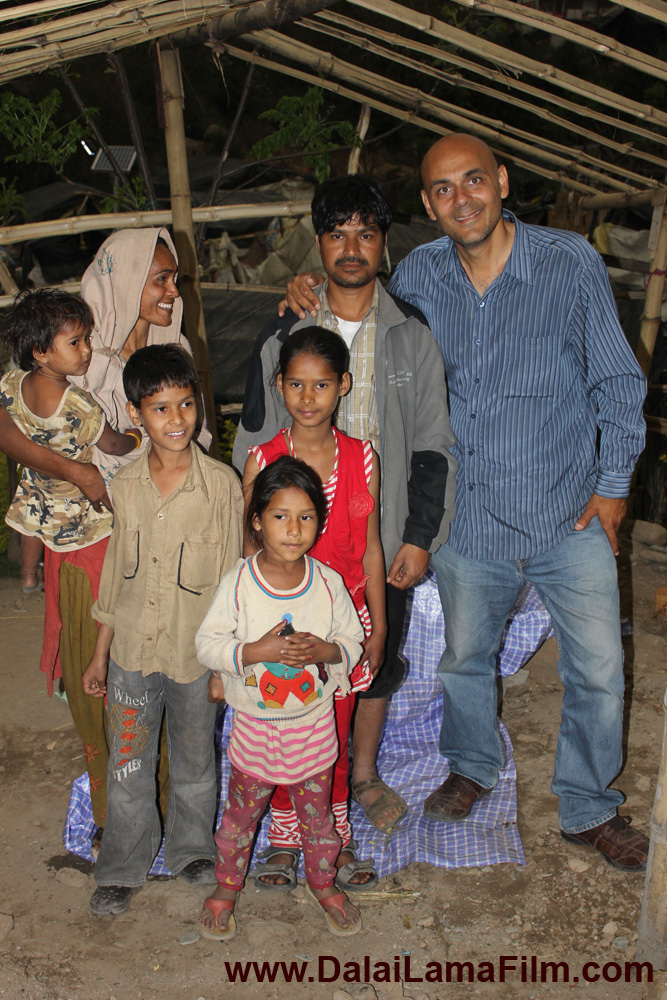 Producer-Director Khashyar Darvich (right) with Viru's family, in their village in the Himalayan mountains of India. None of his children have ever attended school, until this month.