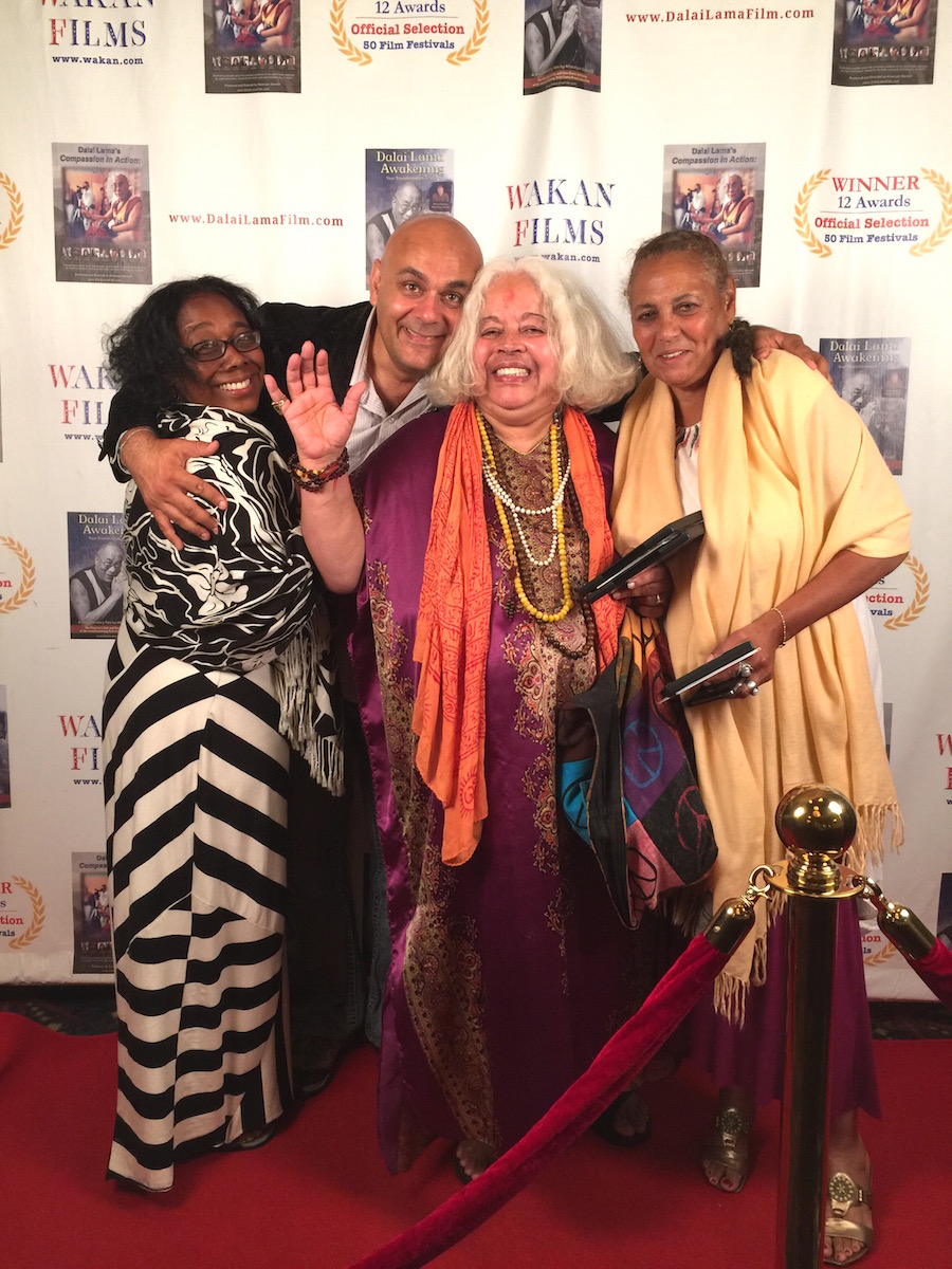 Director Khashyar Darvich with ladies from the red carpet premiere of Dalai Lama Awakening